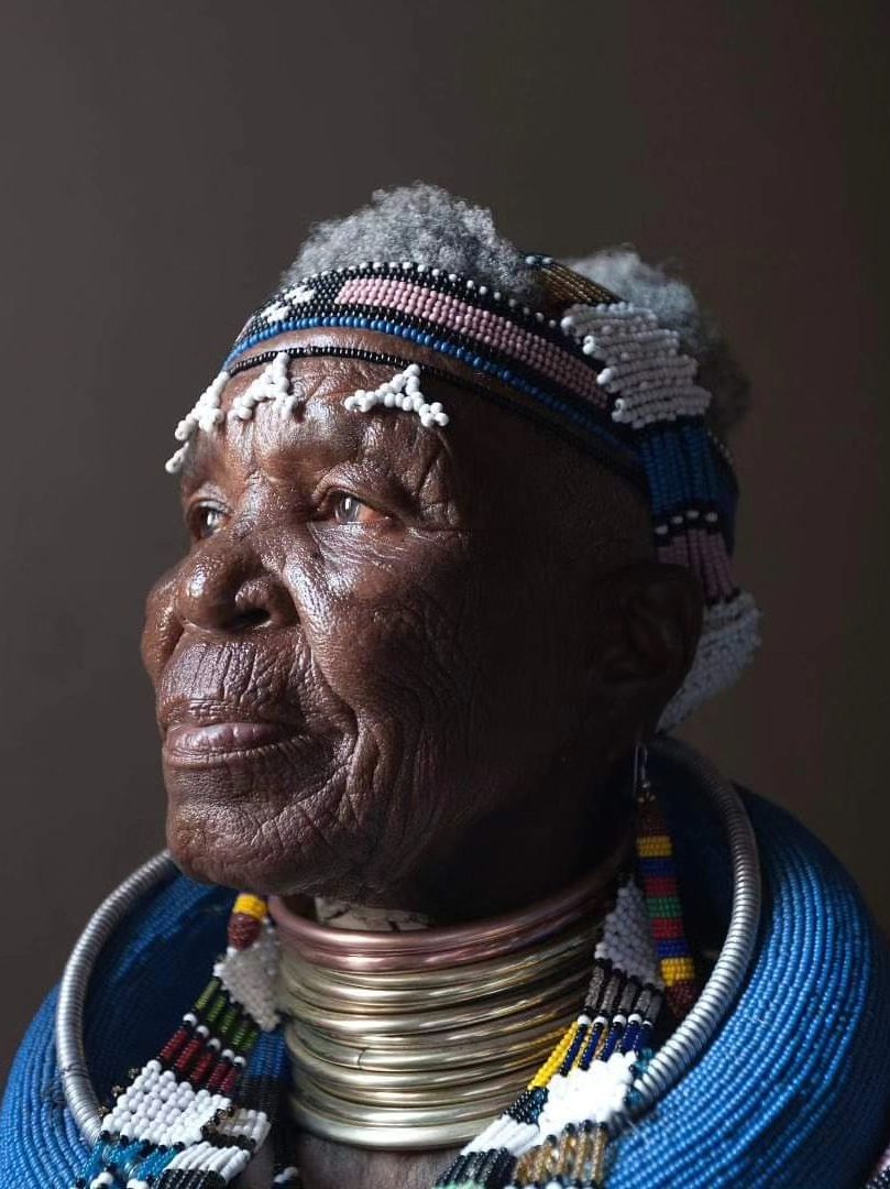 Showcasing The Innovative Esther Mahlangu Alongside Her Iconic BMW Art Car
